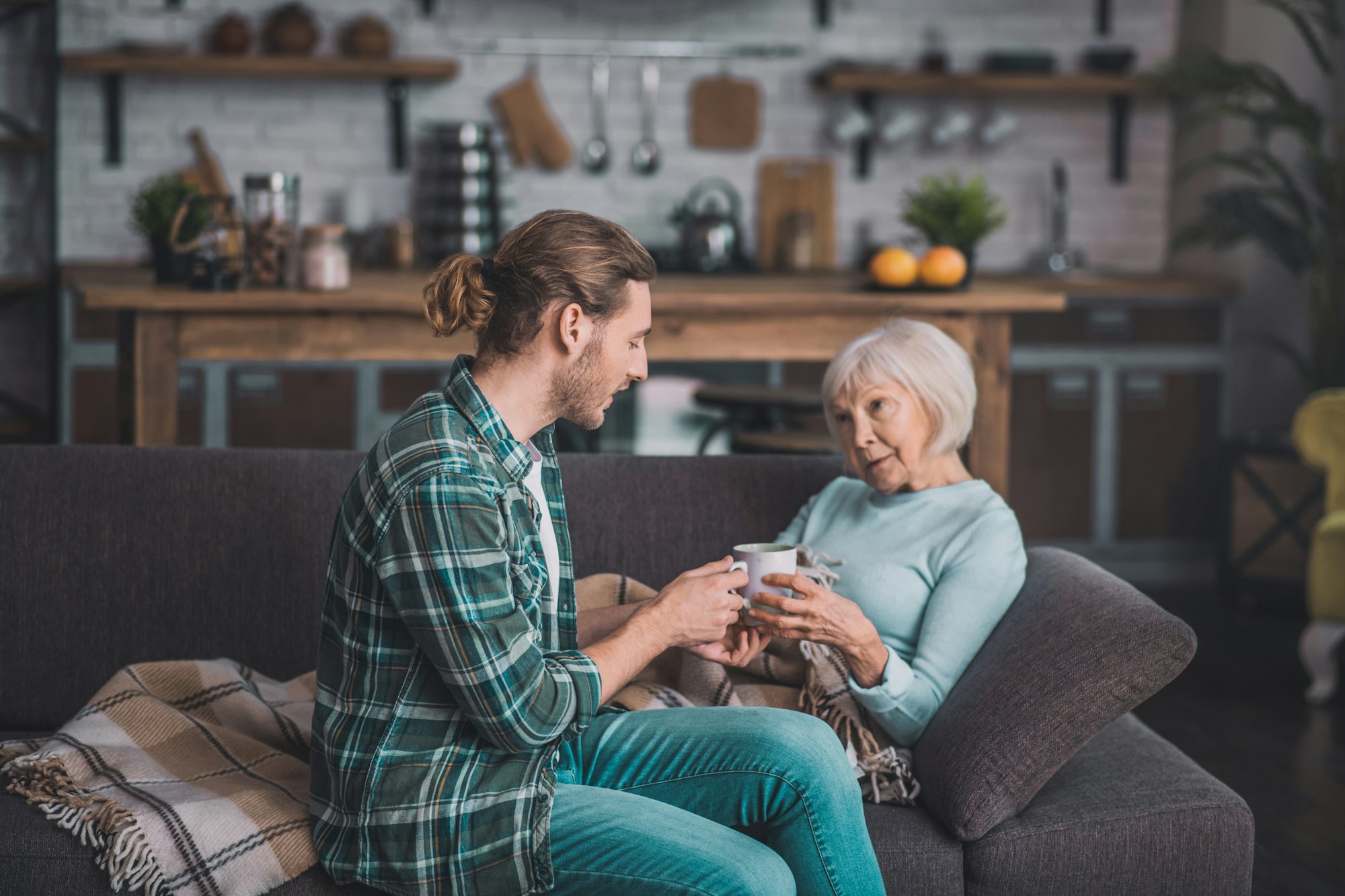 Old lady in with grey hair feeling sick