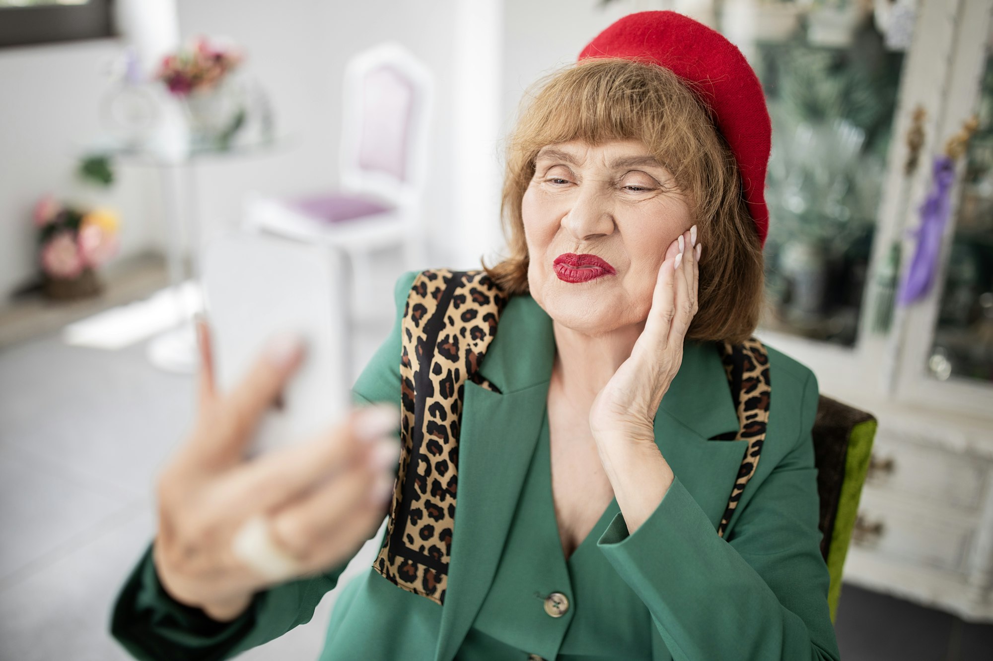 Senior Woman Making Selfie Using Smartphone Having Fun At Cafe
